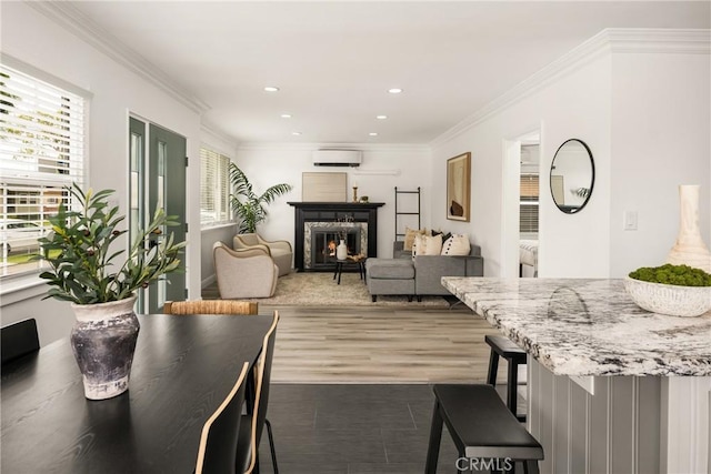 5893 E Adderley Dr, Long Beach, CA 90808 - living area featuring plenty of natural light, an AC wall unit, a high end fireplace, recessed lighting, and wood finished floors