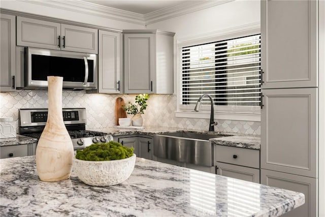 5893 E Adderley Dr, Long Beach, CA 90808 - kitchen featuring appliances with stainless steel finishes, gray cabinetry, a sink, and ornamental molding