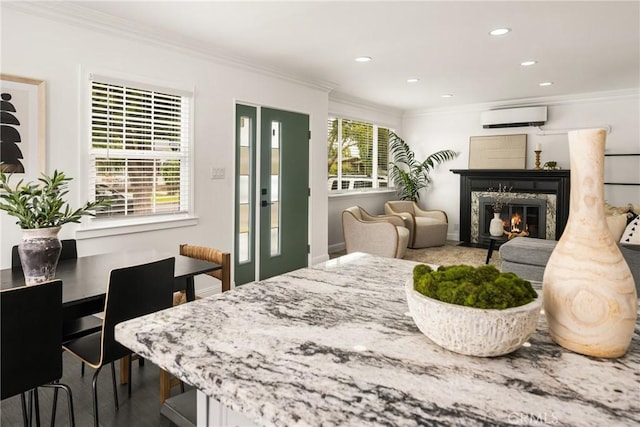 5893 E Adderley Dr, Long Beach, CA 90808 - dining area featuring an AC wall unit, a premium fireplace, ornamental molding, recessed lighting, and baseboards