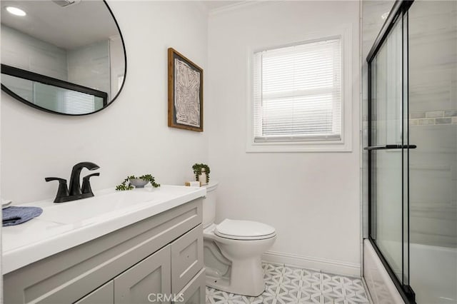 5893 E Adderley Dr, Long Beach, CA 90808 - bathroom with baseboards, vanity, toilet, bath / shower combo with glass door, and ornamental molding