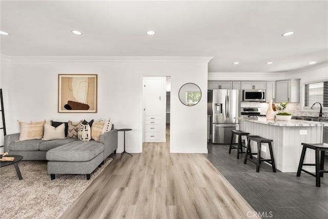 5893 E Adderley Dr, Long Beach, CA 90808 - living room featuring ornamental molding, light wood-style floors, and recessed lighting