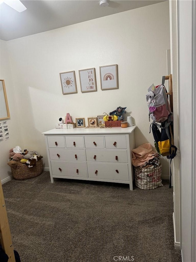 31827 Ives Ct, Menifee, CA 92584 - playroom featuring dark colored carpet, a skylight, and baseboards