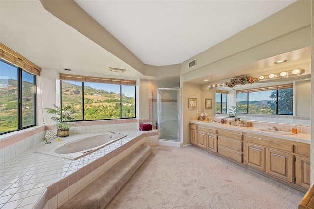 1357 Sunny Heights Rd, Fallbrook, CA 92028 - full bath with a stall shower, double vanity, a garden tub, and plenty of natural light