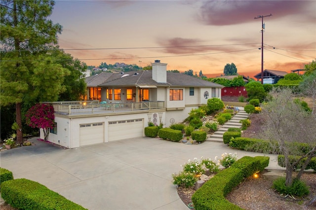1357 Sunny Heights Rd, Fallbrook, CA 92028 - view of front of home with concrete driveway, stucco siding, stairs, a chimney, and an attached garage