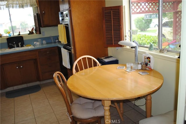 10111 Dewey Dr, Garden Grove, CA 92840 - dining area with light tile patterned floors