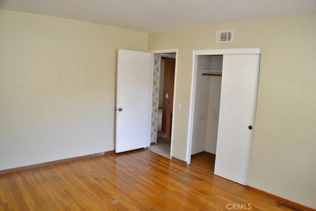 10111 Dewey Dr, Garden Grove, CA 92840 - unfurnished bedroom featuring wood finished floors, a closet, and baseboards