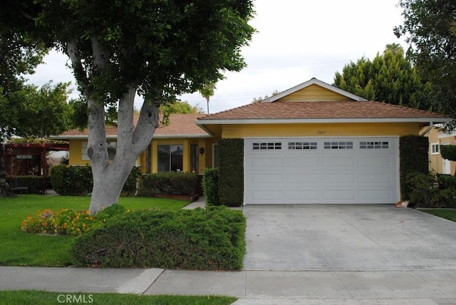 10111 Dewey Dr, Garden Grove, CA 92840 - single story home featuring an attached garage, driveway, a front lawn, and stucco siding