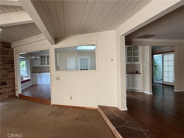 117 S Park Dr, Madera, CA 93637 - empty room with wood ceiling with exposed beams, ornamental molding, wood finished floors, baseboards, and built in shelves