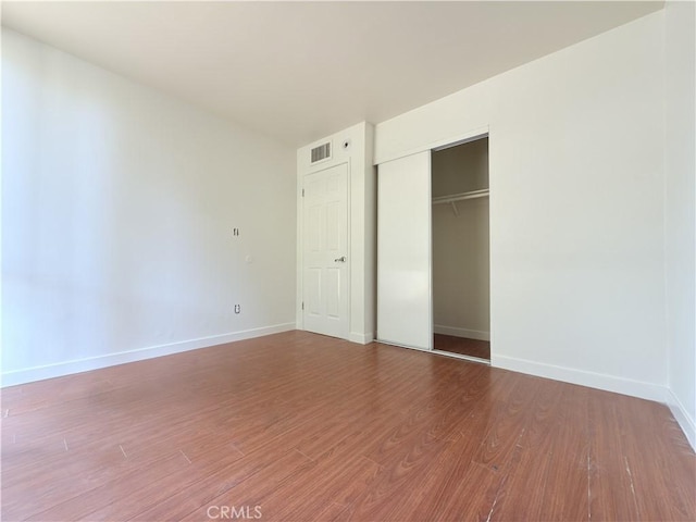 8601 International Ave Unit 179, Canoga Park, CA 91304 - unfurnished bedroom with baseboards, wood finished floors, and a closet
