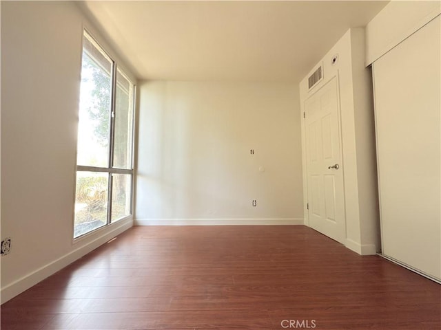 8601 International Ave Unit 179, Canoga Park, CA 91304 - unfurnished room featuring wood finished floors, healthy amount of natural light, and baseboards