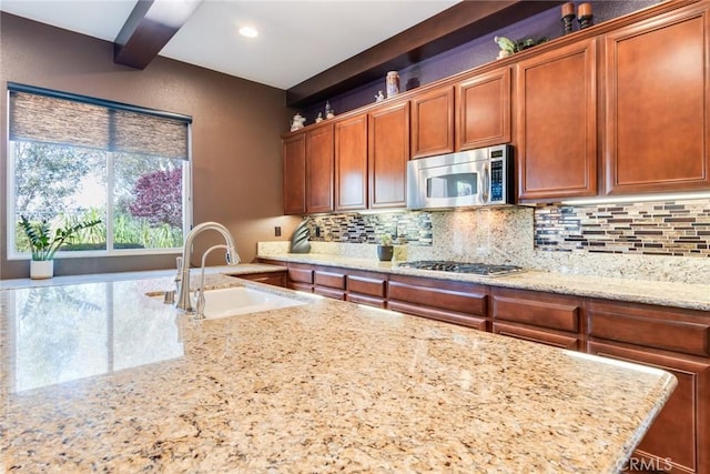 36235 Bay Hill Dr, Beaumont, CA 92223 - kitchen with appliances with stainless steel finishes, a sink, decorative backsplash, light stone counters, and recessed lighting
