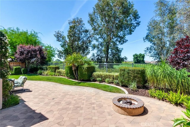 36235 Bay Hill Dr, Beaumont, CA 92223 - fenced backyard with a patio area and an outdoor fire pit