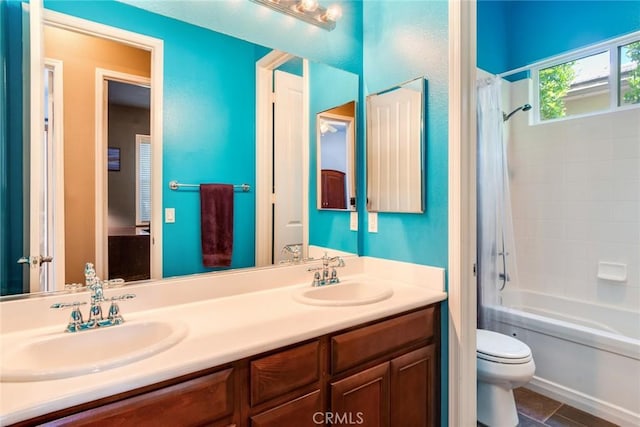 36235 Bay Hill Dr, Beaumont, CA 92223 - bathroom with double vanity, toilet, shower / tub combo with curtain, and tile patterned flooring
