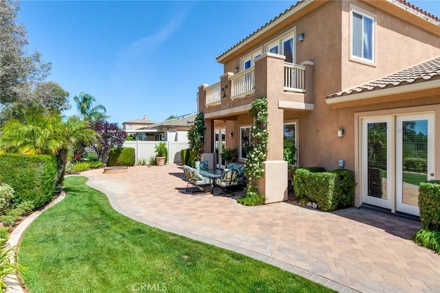 36235 Bay Hill Dr, Beaumont, CA 92223 - rear view of property with a balcony, stucco siding, a patio area, and a tiled roof