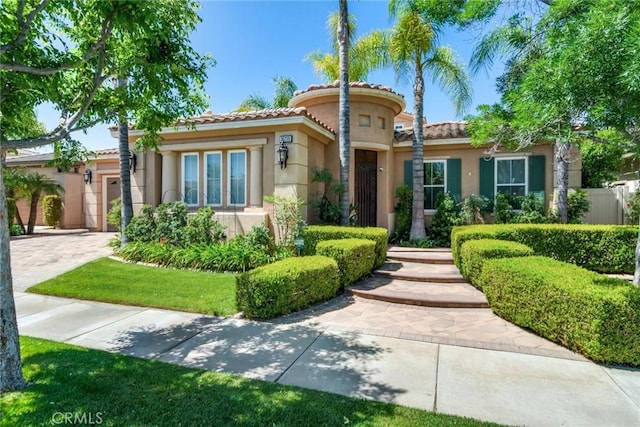 36235 Bay Hill Dr, Beaumont, CA 92223 - mediterranean / spanish home with stucco siding, a tile roof, and driveway