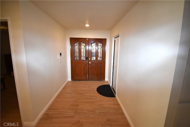 14279 Galleon Ln, Helendale, CA 92342 - doorway with light wood finished floors, baseboards, and recessed lighting