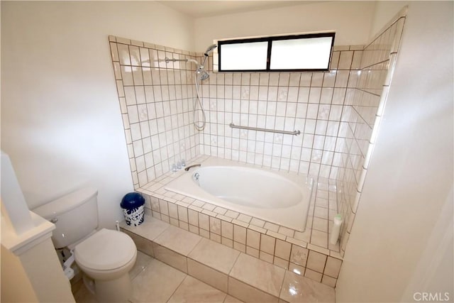 14279 Galleon Ln, Helendale, CA 92342 - bathroom featuring tiled shower / bath combo, toilet, and tile patterned floors