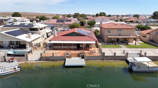 14279 Galleon Ln, Helendale, CA 92342 - dock with a residential view, a water view, a fenced backyard, and a patio area