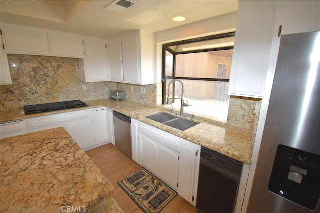 14279 Galleon Ln, Helendale, CA 92342 - kitchen featuring stainless steel appliances, a sink, white cabinets, light wood-type flooring, and light stone countertops