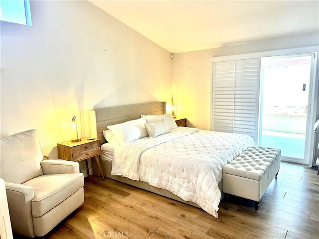 140 W Pioneer Ave Unit 52, Redlands, CA 92374 - bedroom with wood finished floors and access to exterior