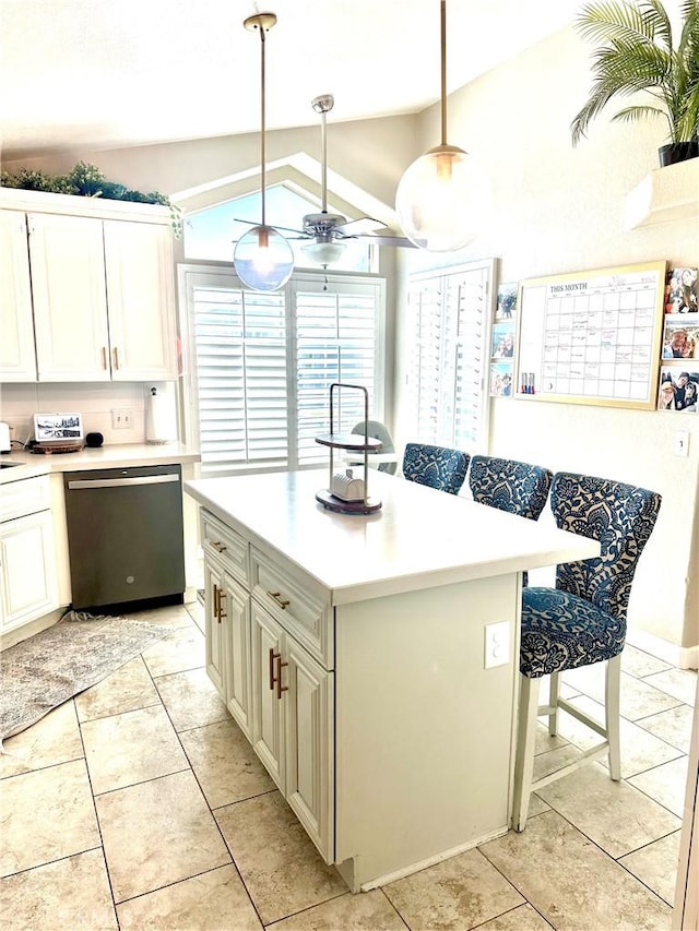 140 W Pioneer Ave Unit 52, Redlands, CA 92374 - kitchen featuring stainless steel dishwasher, vaulted ceiling, light countertops, ceiling fan, and light tile patterned floors
