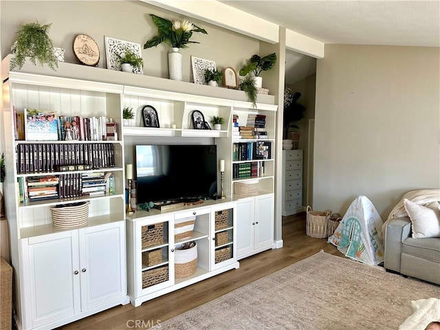 140 W Pioneer Ave Unit 52, Redlands, CA 92374 - living room featuring wood finished floors and vaulted ceiling