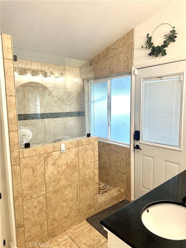 140 W Pioneer Ave Unit 52, Redlands, CA 92374 - full bathroom with a walk in shower, lofted ceiling, vanity, a textured ceiling, and tile patterned floors