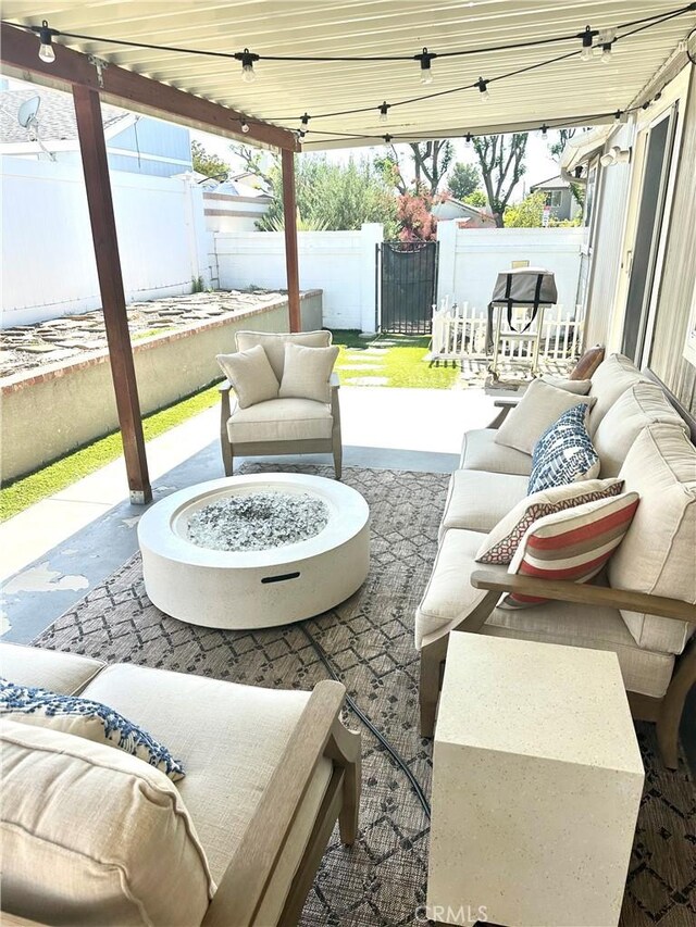 140 W Pioneer Ave Unit 52, Redlands, CA 92374 - view of patio featuring an outdoor living space with a fire pit