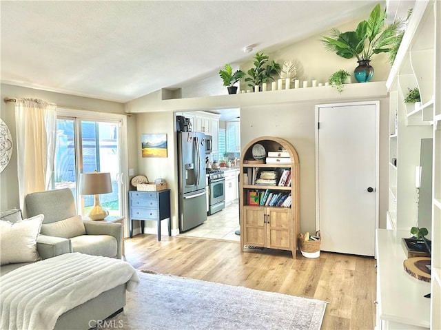 140 W Pioneer Ave Unit 52, Redlands, CA 92374 - living area featuring lofted ceiling and light wood-type flooring