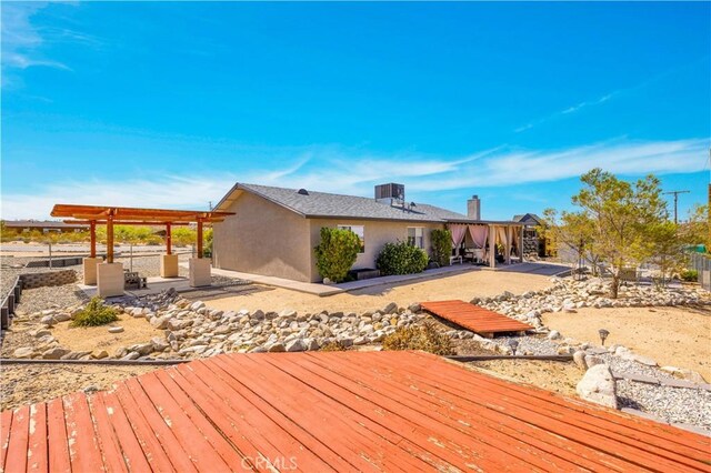 6279 Baileya Ave Unit 29, Palms, CA 92277 - wooden deck with a patio area and a pergola