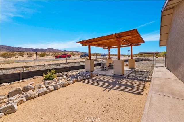 6279 Baileya Ave Unit 29, Palms, CA 92277 - view of patio / terrace with a mountain view and a pergola