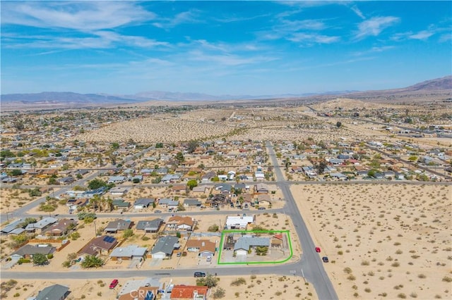 6279 Baileya Ave Unit 29, Palms, CA 92277 - aerial view of residential area with a mountainous background, property boundaries highlighted, and a desert landscape