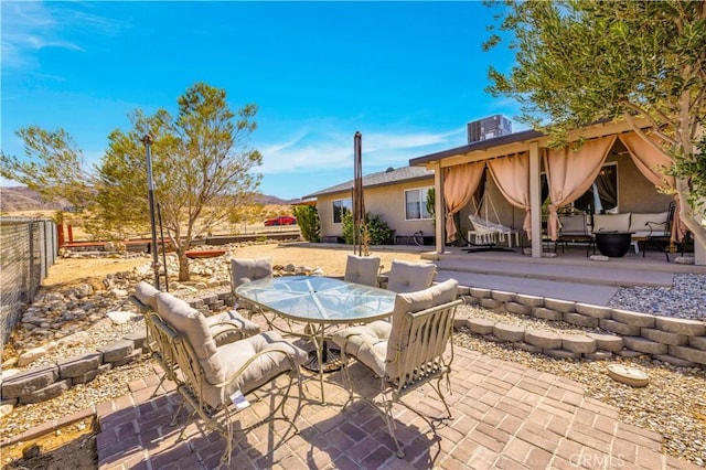 6279 Baileya Ave Unit 29, Palms, CA 92277 - fenced backyard with a patio area and outdoor dining space