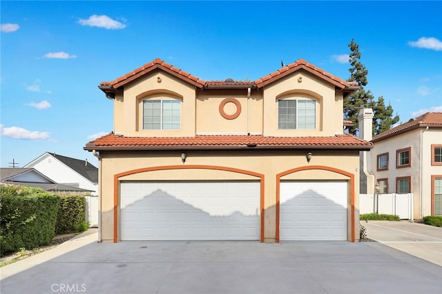4937 Peck Rd Unit C, El Monte, CA 91732 - mediterranean / spanish house with stucco siding, driveway, a tiled roof, and an attached garage