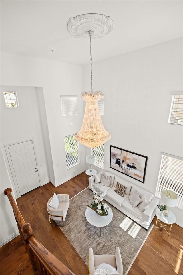 4937 Peck Rd Unit C, El Monte, CA 91732 - living room with a chandelier, wood finished floors, and plenty of natural light