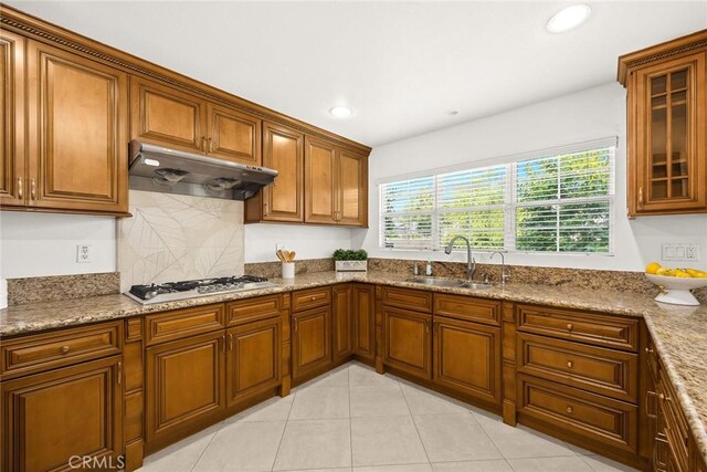 4937 Peck Rd Unit C, El Monte, CA 91732 - kitchen featuring gas stovetop, under cabinet range hood, brown cabinets, recessed lighting, and light tile patterned flooring