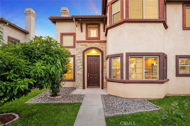 4937 Peck Rd Unit C, El Monte, CA 91732 - entrance to property with stone siding, stucco siding, and a chimney