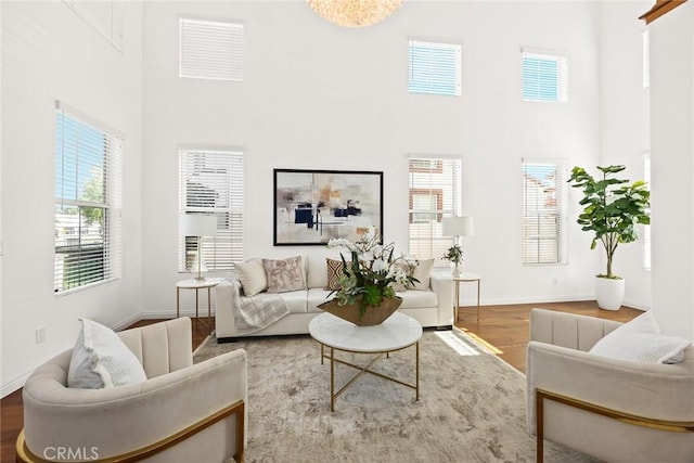 4937 Peck Rd Unit C, El Monte, CA 91732 - living area featuring a high ceiling, wood finished floors, and baseboards
