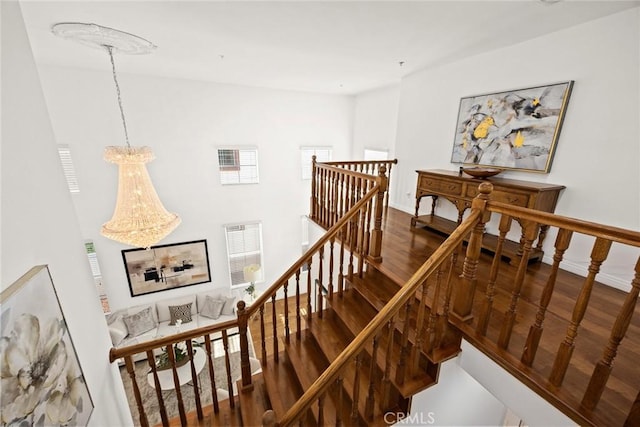 4937 Peck Rd Unit C, El Monte, CA 91732 - stairs with wood finished floors, a chandelier, and baseboards