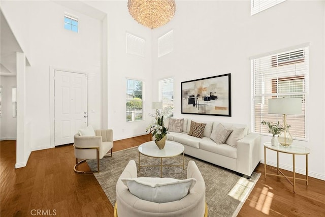 4937 Peck Rd Unit C, El Monte, CA 91732 - living room with wood finished floors, a high ceiling, and baseboards