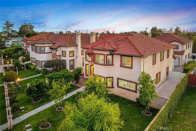 4937 Peck Rd Unit C, El Monte, CA 91732 - view of front of property featuring a chimney, stucco siding, a tile roof, and a residential view