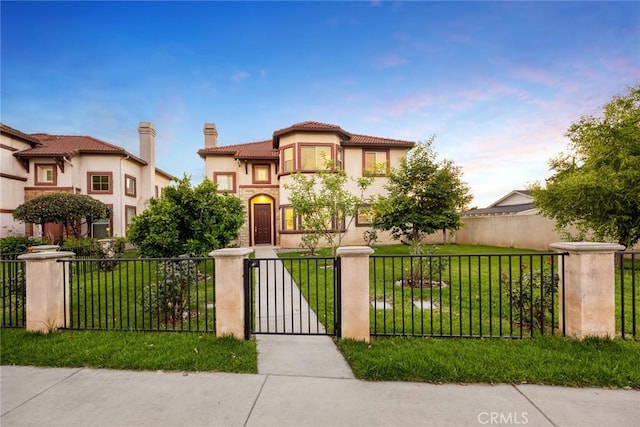 4937 Peck Rd Unit C, El Monte, CA 91732 - mediterranean / spanish house featuring a fenced front yard, stucco siding, a chimney, a gate, and a tiled roof