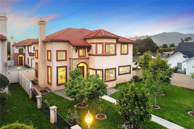 4937 Peck Rd Unit C, El Monte, CA 91732 - mediterranean / spanish-style home featuring stucco siding, a tiled roof, a chimney, and a mountain view
