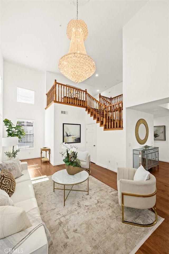 4937 Peck Rd Unit C, El Monte, CA 91732 - living area featuring a towering ceiling, stairs, wood finished floors, baseboards, and recessed lighting
