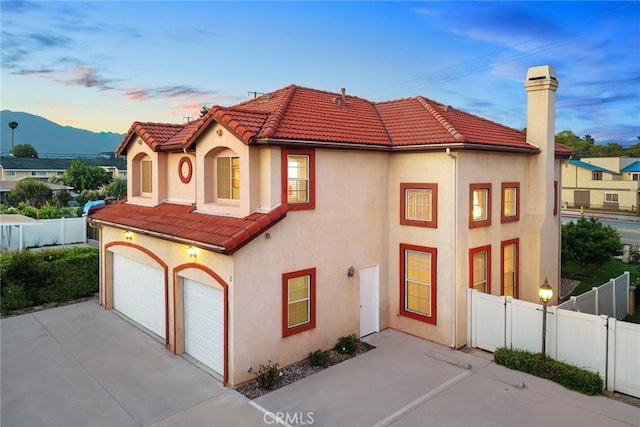 4937 Peck Rd Unit C, El Monte, CA 91732 - mediterranean / spanish-style house with a tiled roof, stucco siding, a garage, and driveway