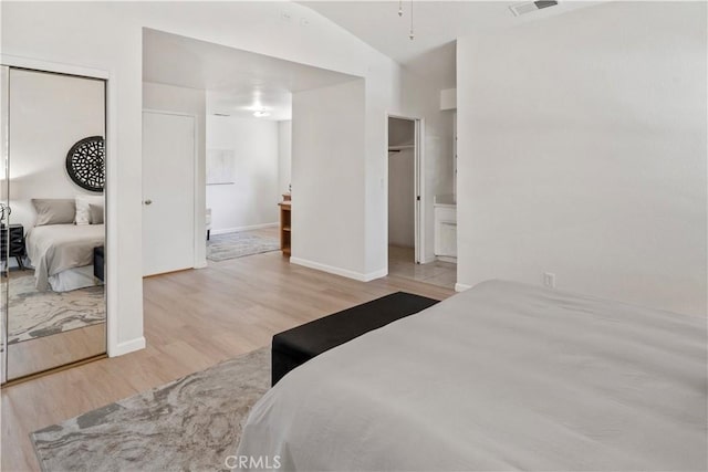 3014 California Park Dr, Chico, CA 95928 - bedroom with a closet, wood finished floors, and connected bathroom