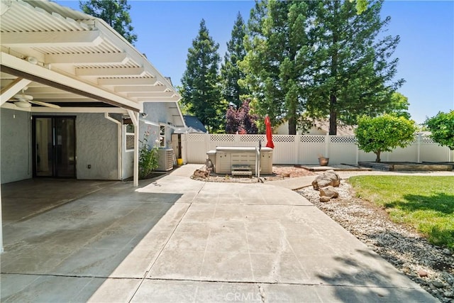 3014 California Park Dr, Chico, CA 95928 - fenced backyard with a hot tub, a patio, and central AC