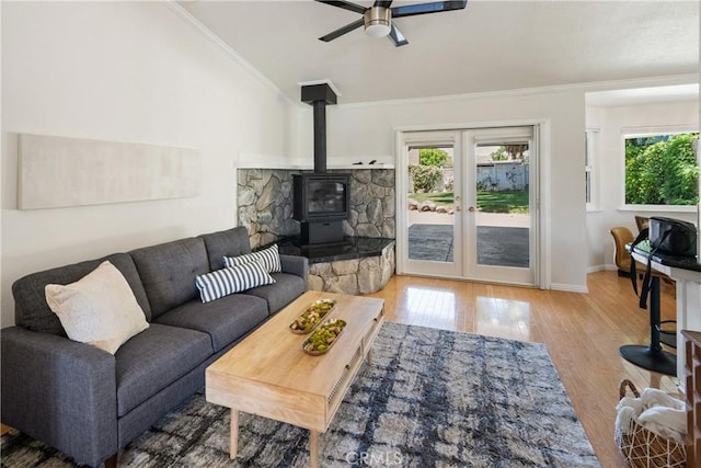 3014 California Park Dr, Chico, CA 95928 - living area featuring lofted ceiling, wood finished floors, ceiling fan, a wood stove, and french doors