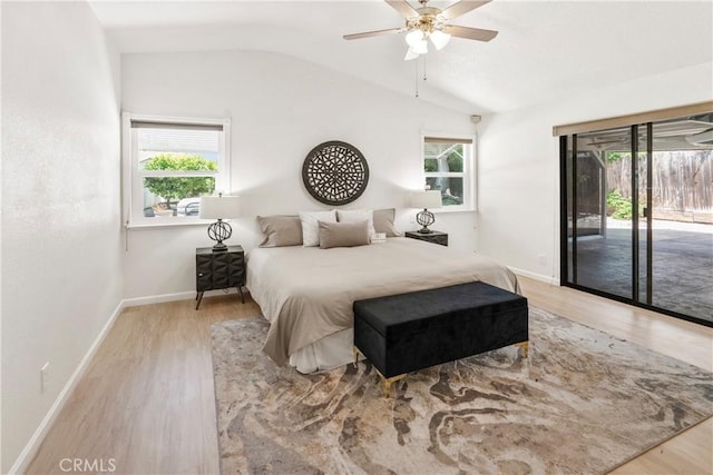 3014 California Park Dr, Chico, CA 95928 - bedroom featuring access to exterior, lofted ceiling, multiple windows, and light wood finished floors