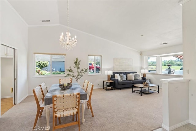 3014 California Park Dr, Chico, CA 95928 - dining room with light colored carpet, a chandelier, vaulted ceiling, and ornamental molding